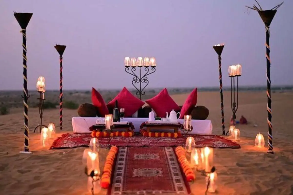 A private desert dinner laid out at Khayal Al Sahra