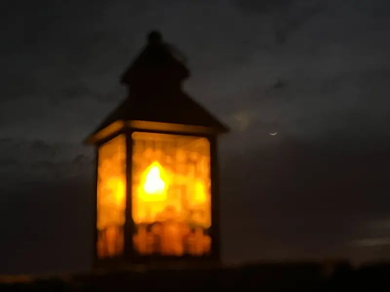 A glowing Ramadan lantern at night