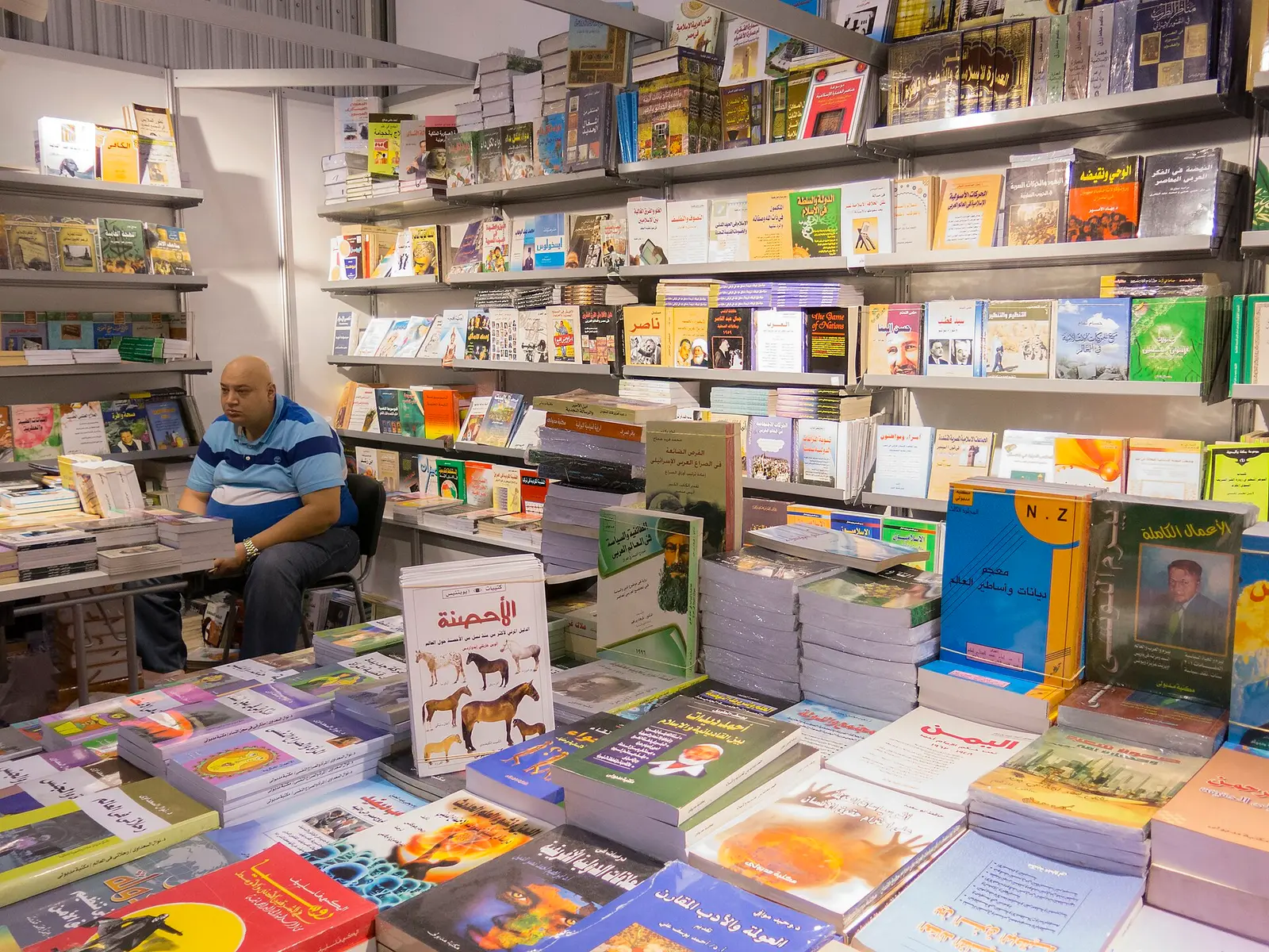 A bookseller at his stall at the Sharjah International Book Fair