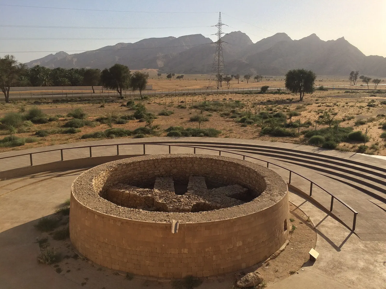 A circular Bronze Age tomb at Mleiha with the Hajar Mountains behind